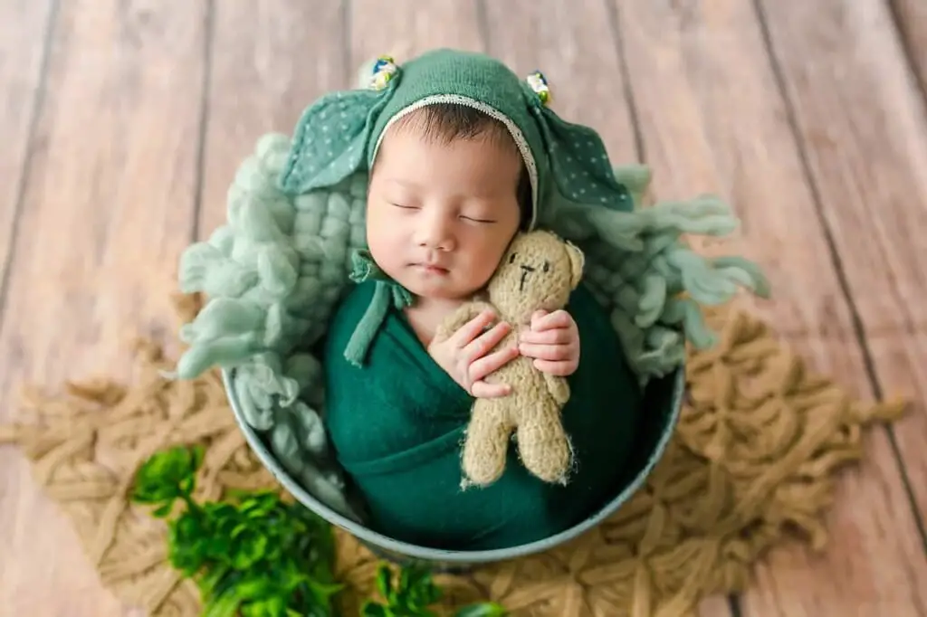 Crib mattress and a soft toy is all it takes for a newborn photoshoot
