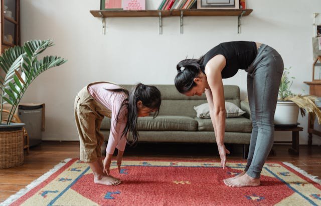 Yoga poses like forward bend calms the nervous system, helping them feel more at ease