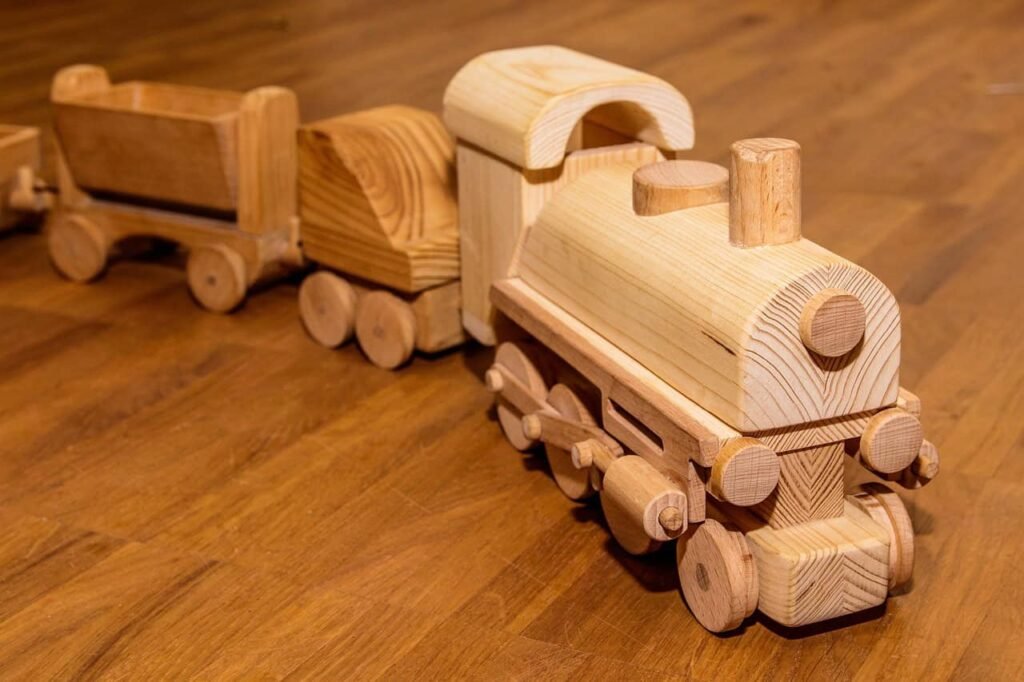 wooden toy train engine with two carriages